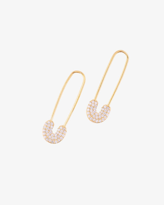 Safety pin earrings in gold